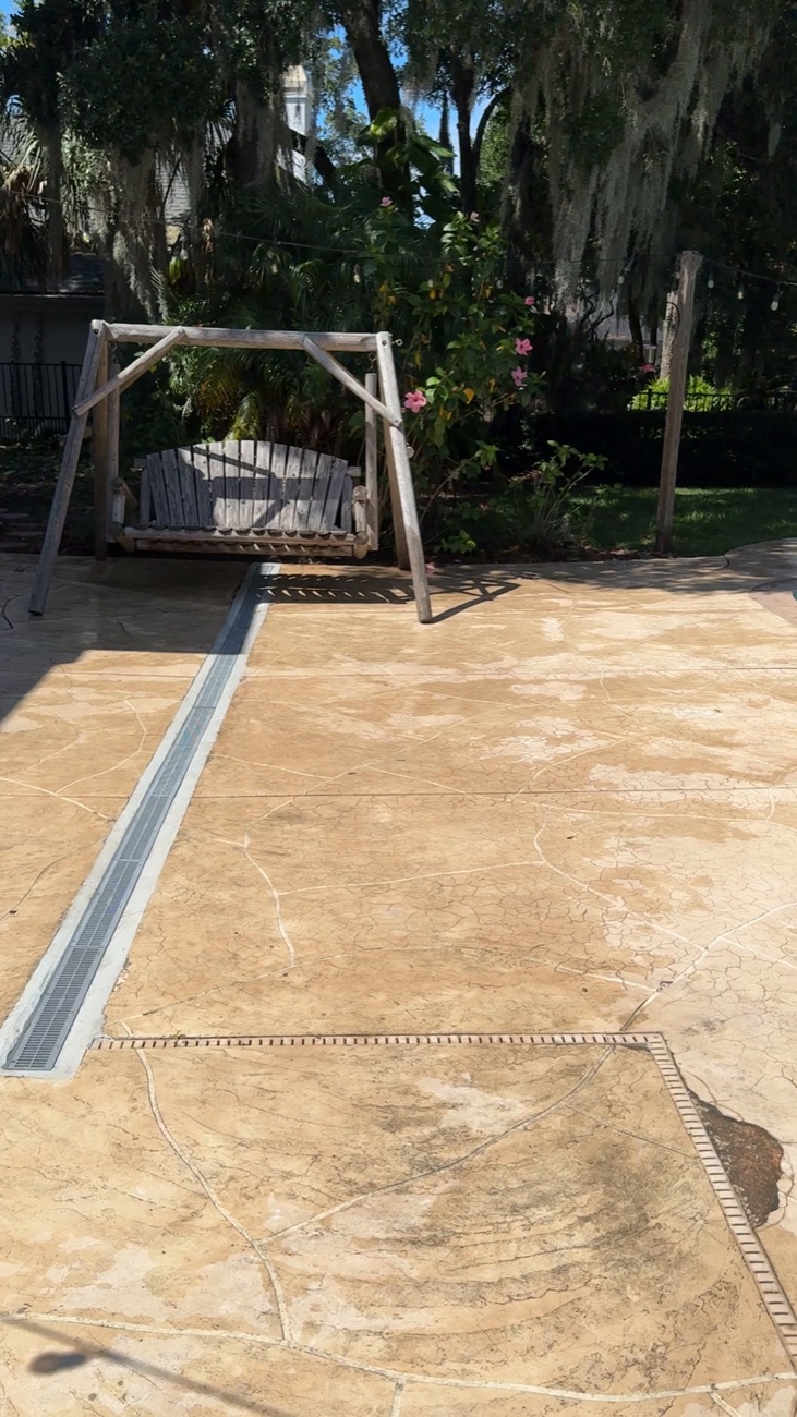 Channel drain along a pool deck carrying storm water away in Ponte Vedra