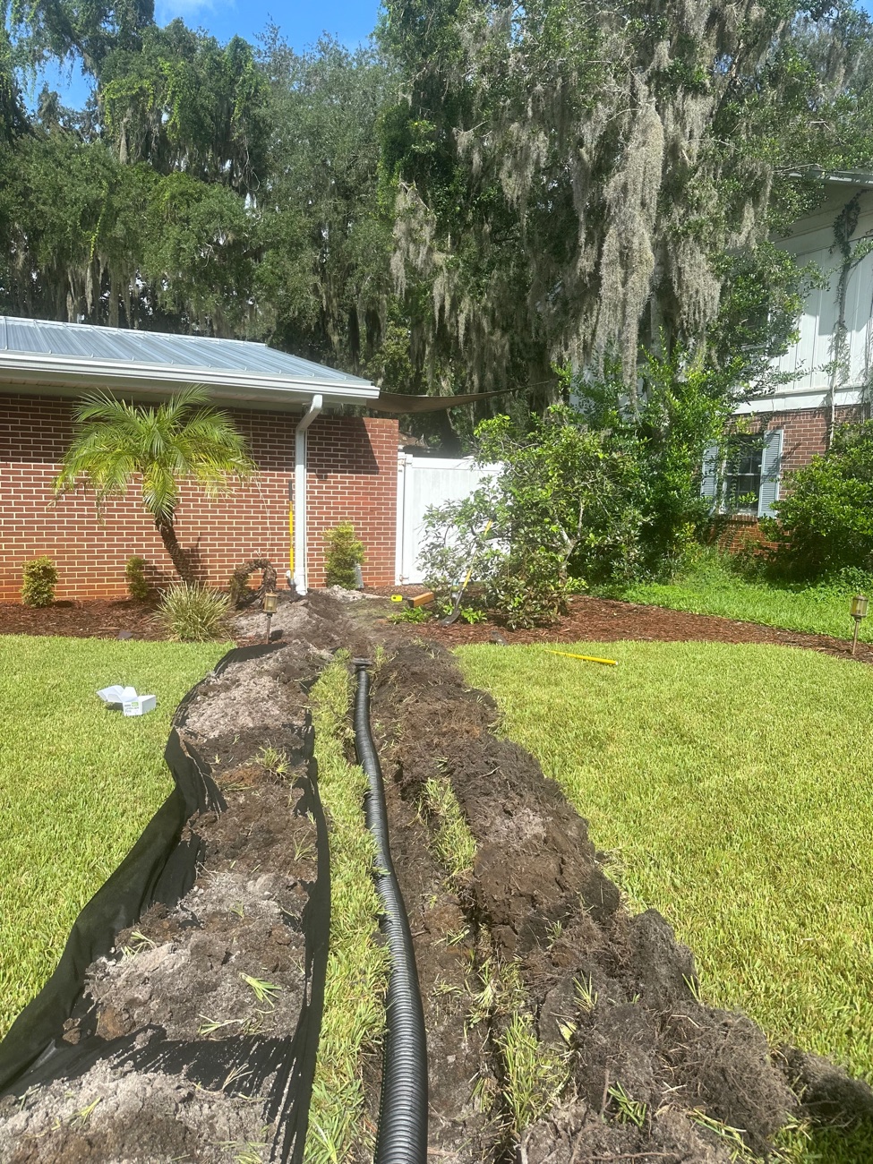 Drainage installation moving stormwater away from a Northeast Florida home