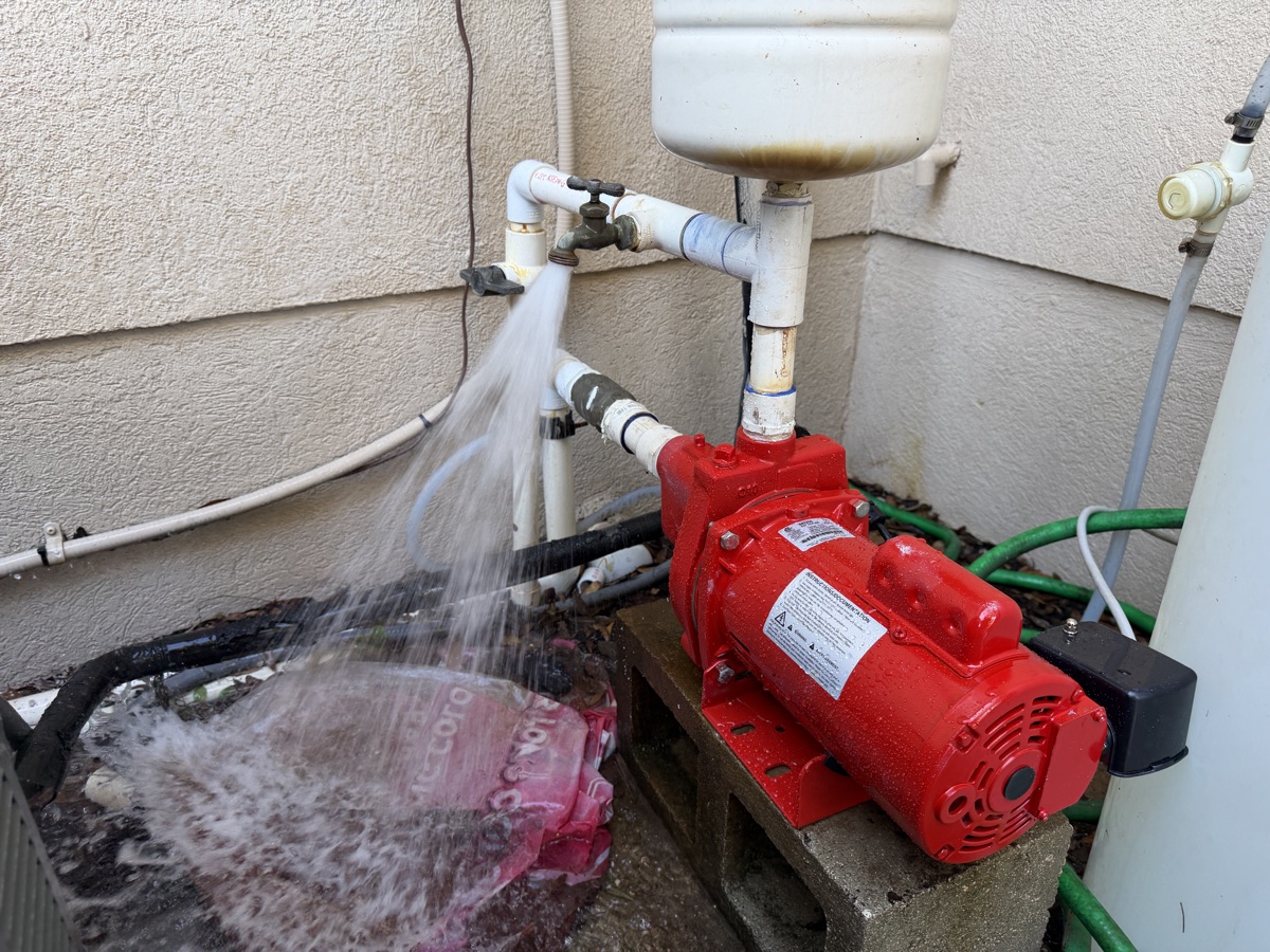 Red Lion 1 HP irrigation pump installed beside a home in St. Johns County