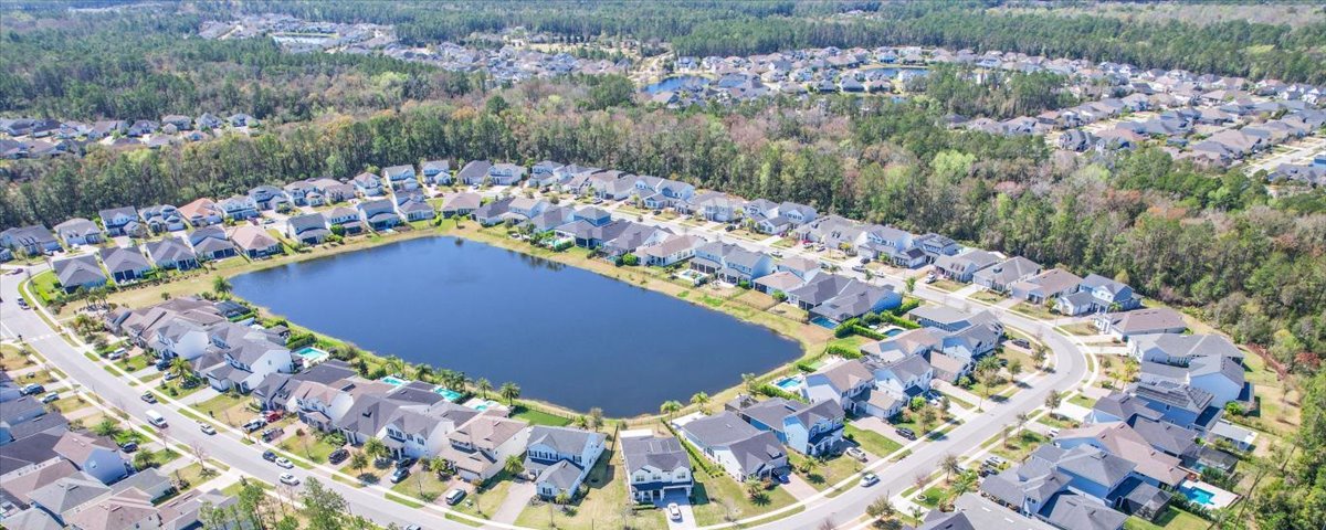 Aerial view of a Nocatee neighborhood around a lake in Ponte Vedra, FL 32081 — the community Aqua Premier serves for sprinkler repair, drainage and gutters