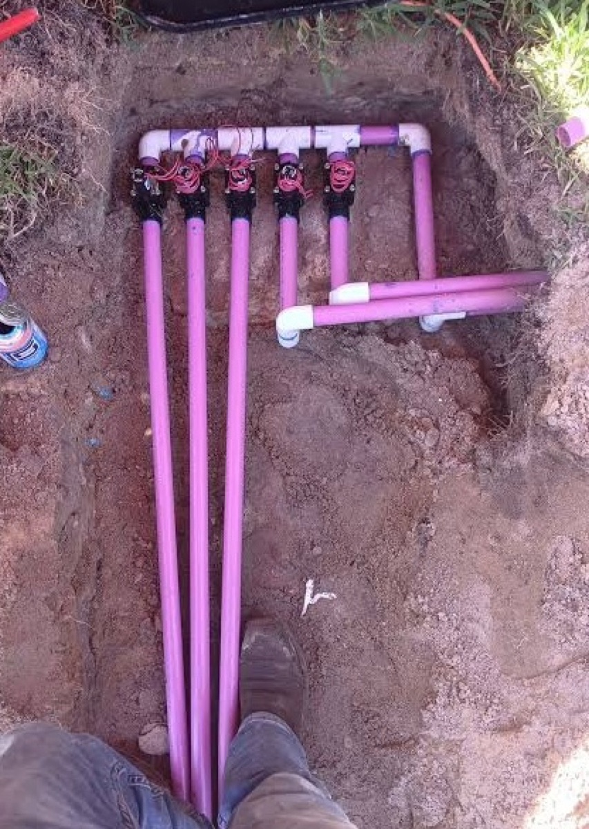 Purple reclaimed-water irrigation pipes installed in a trench in Nocatee